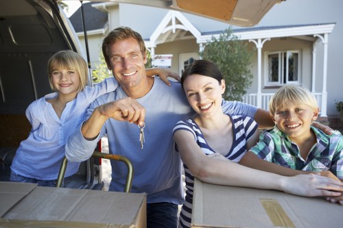 Professional movers handling office equipment